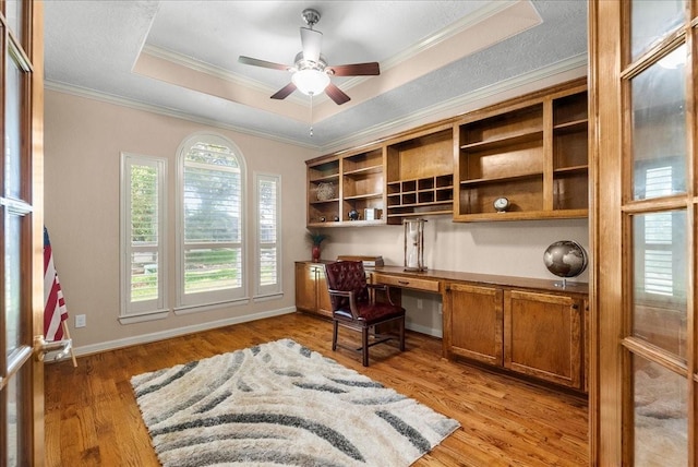 3707 Charleston St, Houston, TX 77021 - office with built in desk, a raised ceiling, ornamental molding, ceiling fan, and light wood-style floors
