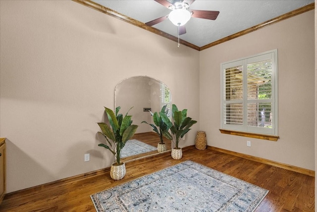 3707 Charleston St, Houston, TX 77021 - detailed view of crown molding, ceiling fan, wood finished floors, and baseboards