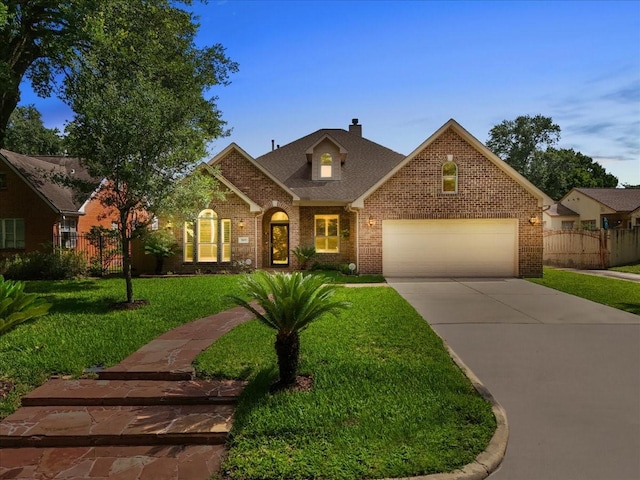 3707 Charleston St, Houston, TX 77021 - traditional-style house featuring brick siding, concrete driveway, a garage, and a chimney