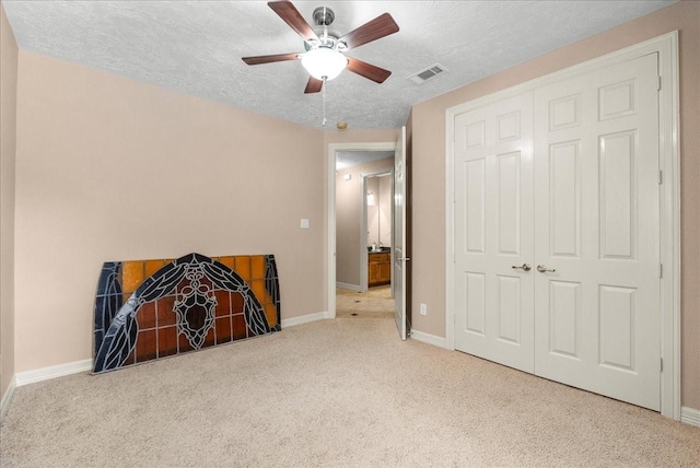 3707 Charleston St, Houston, TX 77021 - bedroom with carpet floors, baseboards, a textured ceiling, a ceiling fan, and a closet