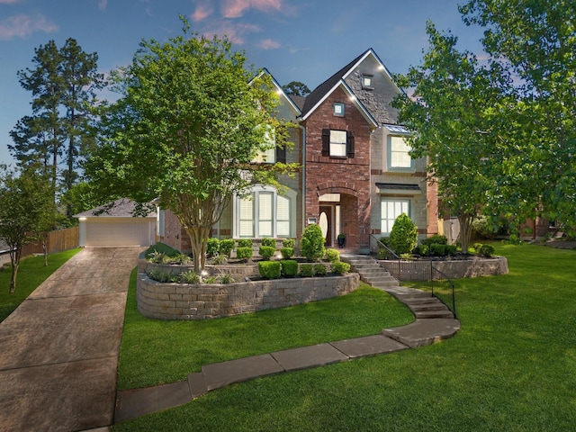 2153 Summit Mist Dr, Conroe, TX 77304 - view of front facade featuring brick siding, a front yard, and a detached garage