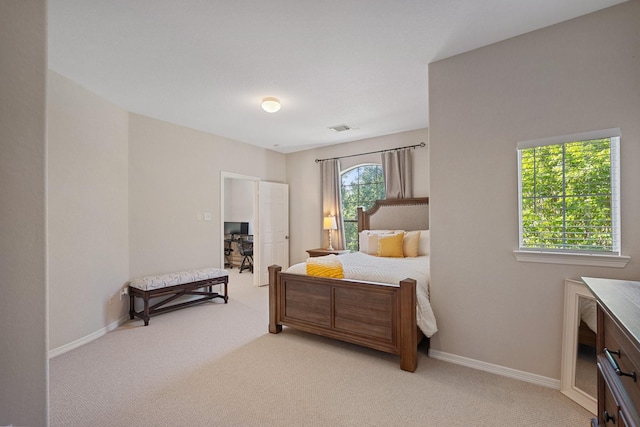 2153 Summit Mist Dr, Conroe, TX 77304 - bedroom featuring light carpet and baseboards
