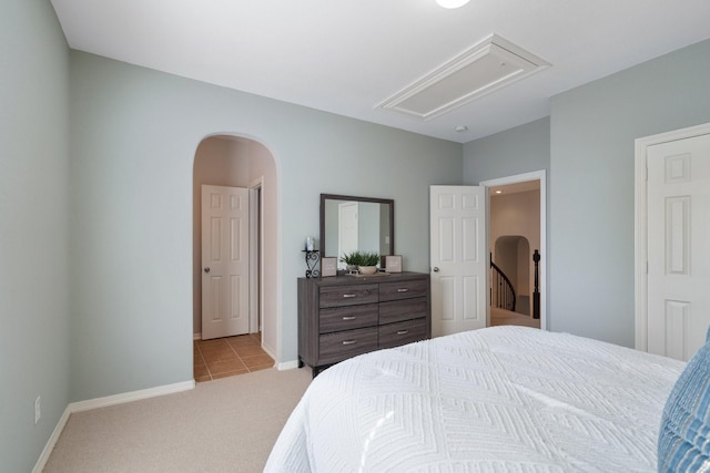 2153 Summit Mist Dr, Conroe, TX 77304 - bedroom with attic access, light colored carpet, light tile patterned floors, and baseboards