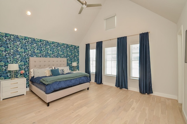 2419 W Kolbe Ln, Houston, TX 77080 - bedroom with wallpapered walls, baseboards, an accent wall, light wood-style flooring, and recessed lighting