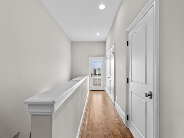 1616 Rosewood St, Houston, TX 77004 - corridor featuring wood finished floors, recessed lighting, and an upstairs landing