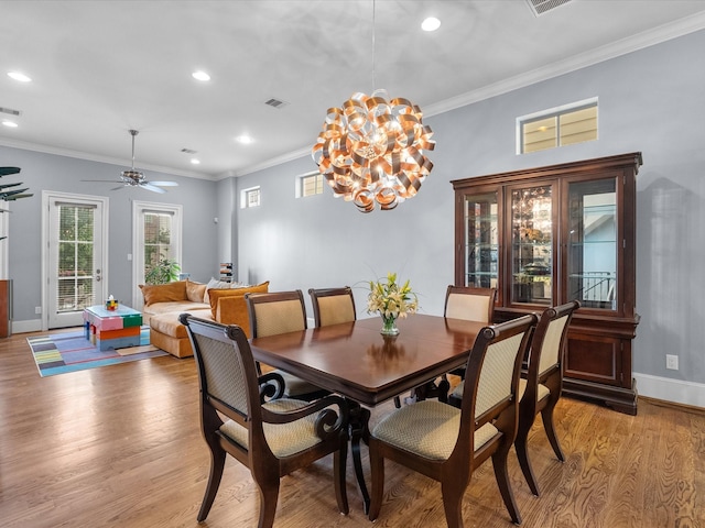 1616 Rosewood St, Houston, TX 77004 - dining room with light wood-type flooring, recessed lighting, a chandelier, crown molding, and ceiling fan