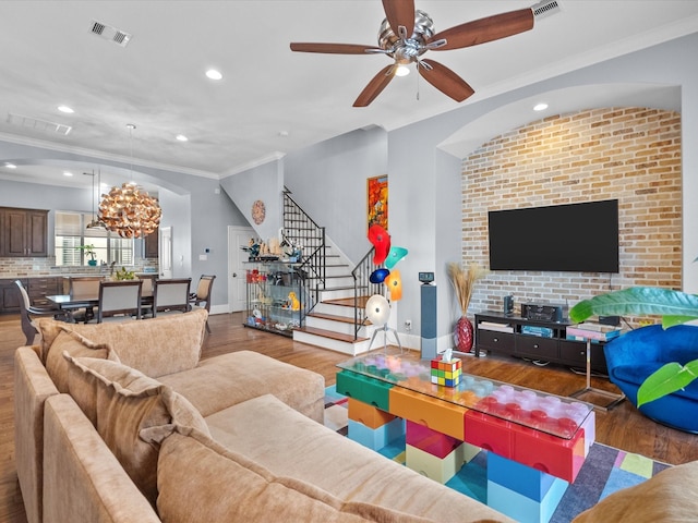1616 Rosewood St, Houston, TX 77004 - living room with wood finished floors, recessed lighting, crown molding, stairway, and ceiling fan