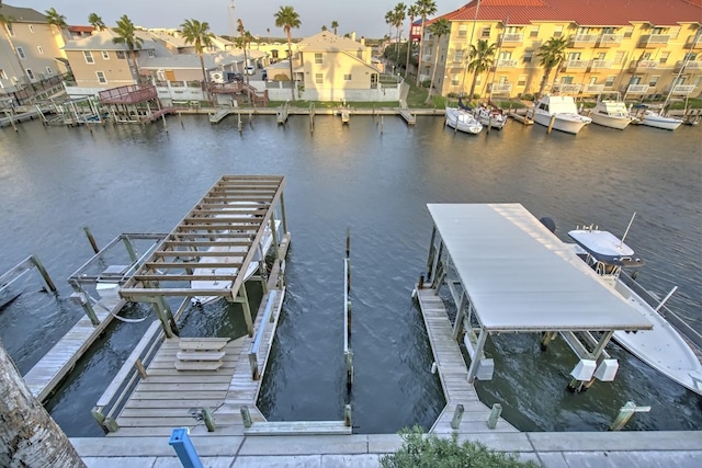 14434 E Cabana St Unit 319, Corpus Christi, TX 78418 - dock area featuring a water view, boat lift, and a residential view