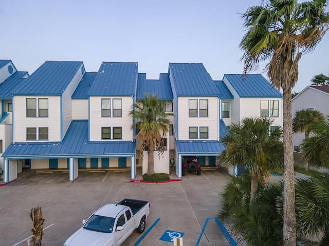 14434 E Cabana St Unit 319, Corpus Christi, TX 78418 - view of building exterior with uncovered parking