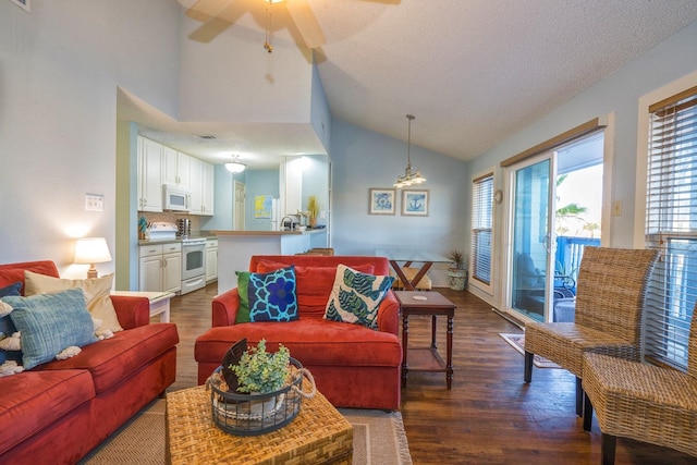 14434 E Cabana St Unit 319, Corpus Christi, TX 78418 - living room featuring dark wood-style flooring, a ceiling fan, and high vaulted ceiling