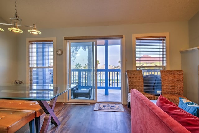14434 E Cabana St Unit 319, Corpus Christi, TX 78418 - doorway to outside featuring wood finished floors and plenty of natural light