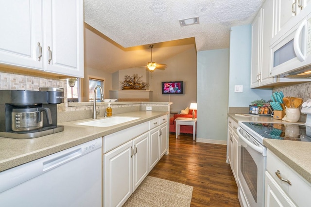 14434 E Cabana St Unit 319, Corpus Christi, TX 78418 - kitchen featuring white appliances, a sink, backsplash, light countertops, and a textured ceiling