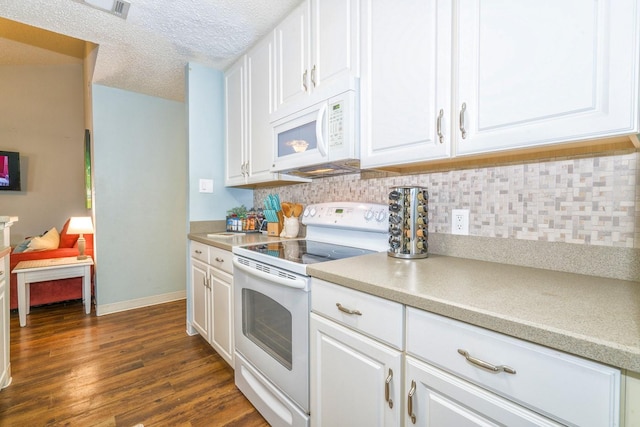 14434 E Cabana St Unit 319, Corpus Christi, TX 78418 - kitchen with white appliances, decorative backsplash, white cabinetry, dark wood-style flooring, and a textured ceiling