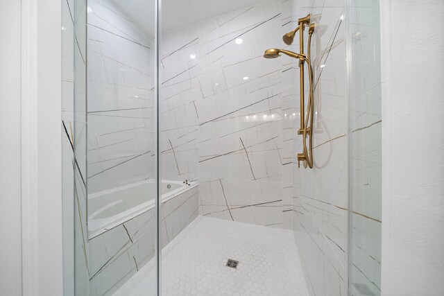 11120 Savannah Woods Ln, Houston, TX 77043 - full bathroom featuring a marble finish shower and a tub with marble appearance