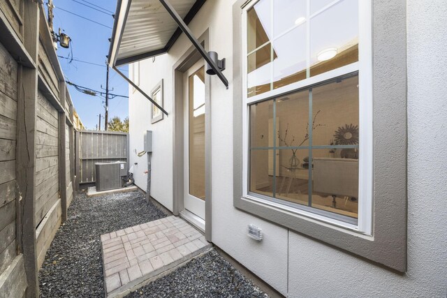 11120 Savannah Woods Ln, Houston, TX 77043 - view of patio featuring central AC unit