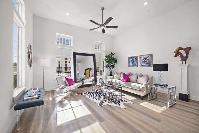 11120 Savannah Woods Ln, Houston, TX 77043 - living area with wood finished floors, healthy amount of natural light, ceiling fan, baseboards, and recessed lighting