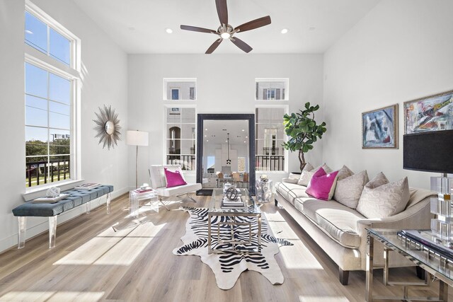 11120 Savannah Woods Ln, Houston, TX 77043 - living room with a ceiling fan, baseboards, wood finished floors, a high ceiling, and recessed lighting