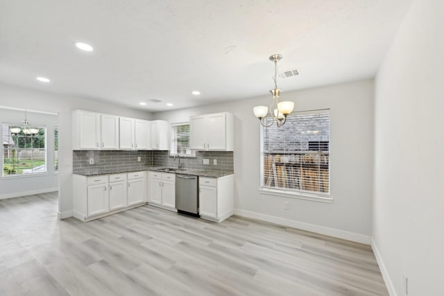 2707 Shawna Lyn Dr, Spring, TX 77373 - kitchen with a chandelier, stainless steel dishwasher, white cabinets, stone counters, and recessed lighting
