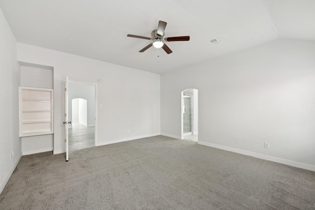 2707 Shawna Lyn Dr, Spring, TX 77373 - empty room featuring arched walkways, ceiling fan, carpet flooring, and lofted ceiling