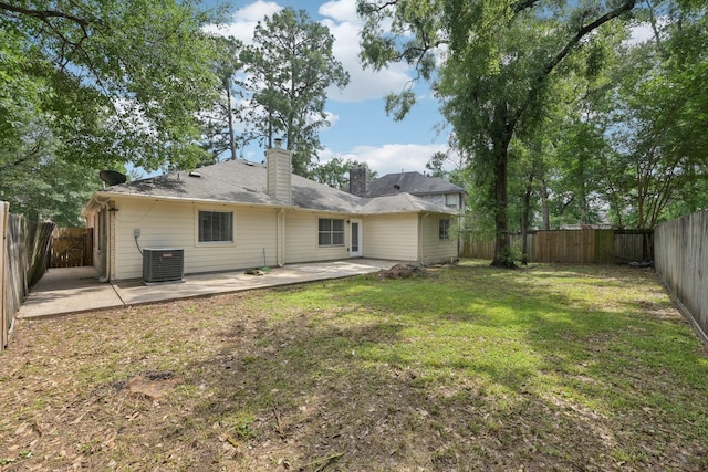 2707 Shawna Lyn Dr, Spring, TX 77373 - rear view of house with a patio, a chimney, and a fenced backyard