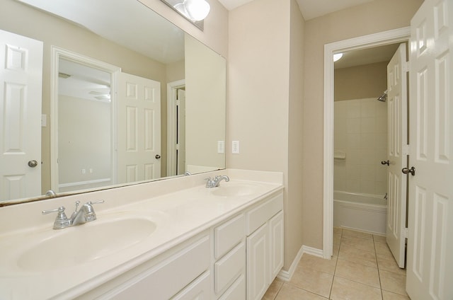 902 Aqua Vista Ln, Rosenberg, TX 77469 - bathroom featuring double vanity, tile patterned flooring, shower / washtub combination, and baseboards