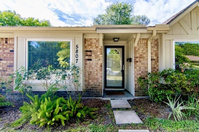 5807 Silver Forest Dr, Houston, TX 77092 - entrance to property featuring brick siding and board and batten siding