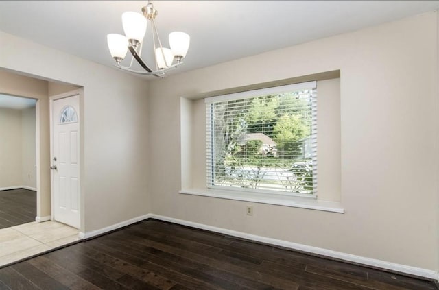 5807 Silver Forest Dr, Houston, TX 77092 - spare room with hardwood / wood-style floors and a chandelier