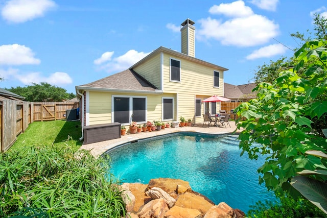 2223 Caroline Park Ln, Spring, TX 77386 - rear view of property with a chimney, roof with shingles, and a patio