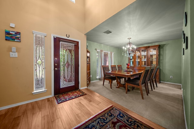 2223 Caroline Park Ln, Spring, TX 77386 - foyer featuring a chandelier, baseboards, and wood finished floors