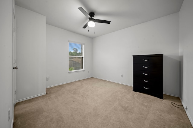 2223 Caroline Park Ln, Spring, TX 77386 - unfurnished bedroom with light colored carpet, baseboards, and ceiling fan