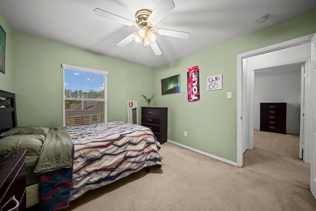 2223 Caroline Park Ln, Spring, TX 77386 - bedroom featuring light colored carpet, baseboards, and a ceiling fan