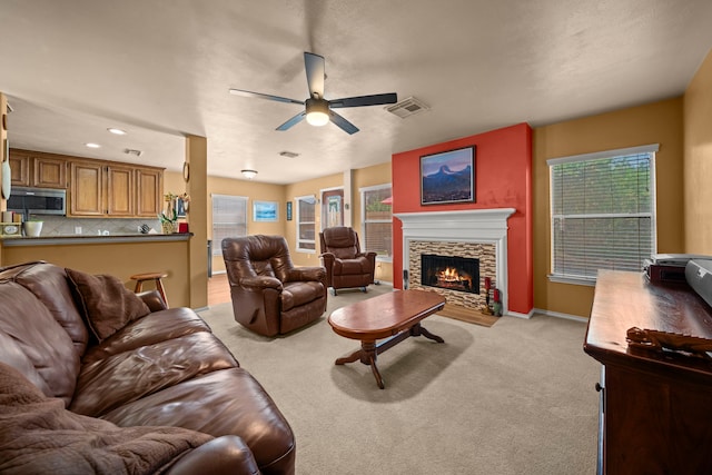 2223 Caroline Park Ln, Spring, TX 77386 - living room with ceiling fan, light colored carpet, a fireplace, baseboards, and recessed lighting