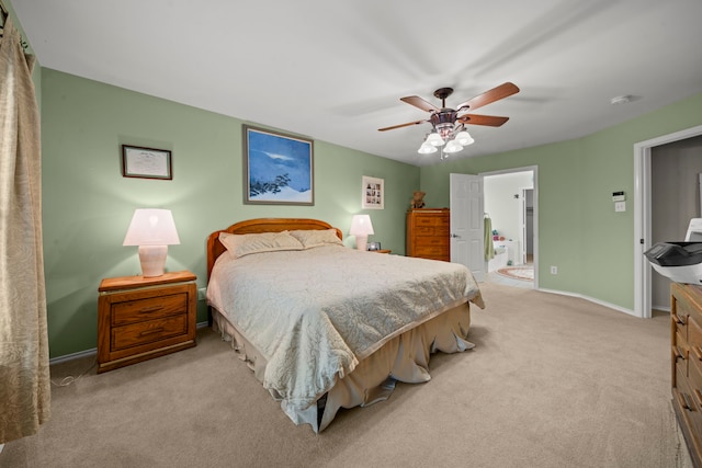 2223 Caroline Park Ln, Spring, TX 77386 - bedroom featuring light carpet, baseboards, and ceiling fan
