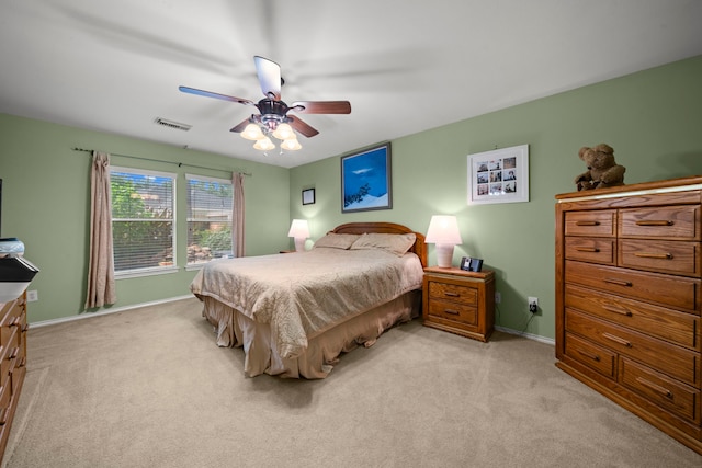 2223 Caroline Park Ln, Spring, TX 77386 - bedroom featuring light carpet, baseboards, and a ceiling fan