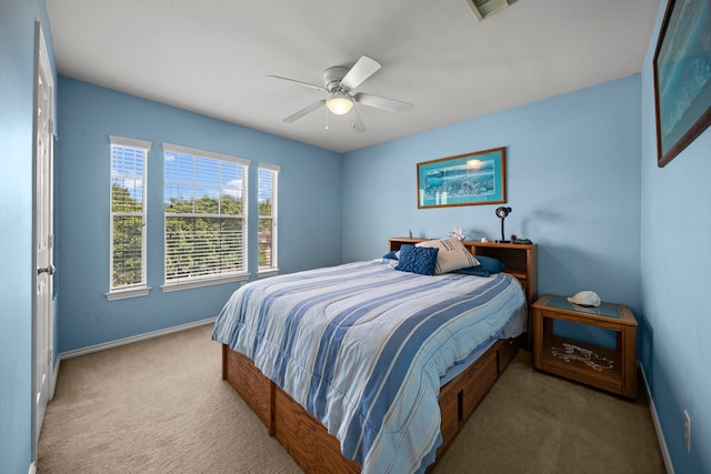 2223 Caroline Park Ln, Spring, TX 77386 - carpeted bedroom with baseboards and ceiling fan