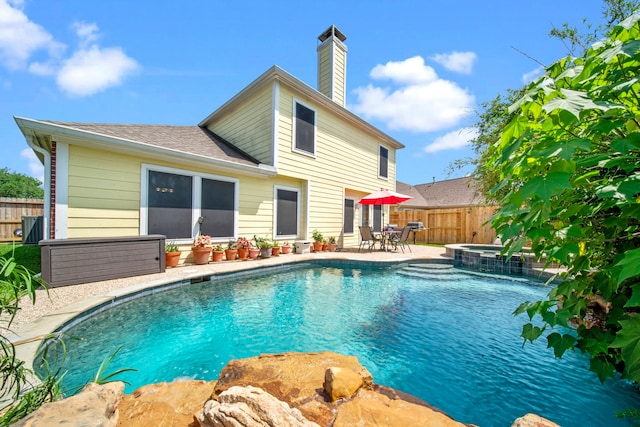 2223 Caroline Park Ln, Spring, TX 77386 - view of swimming pool with a fenced backyard, a patio area, and a pool with connected hot tub