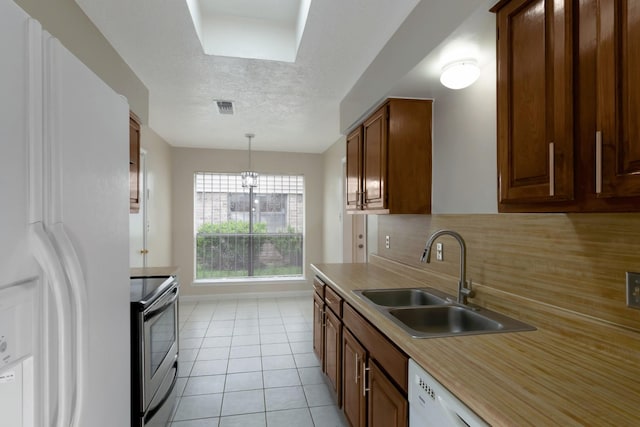 11014 Kirkridge Dr, Houston, TX 77089 - kitchen with electric range, white refrigerator with ice dispenser, a sink, tasteful backsplash, and light countertops