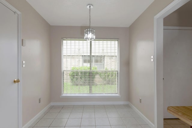 11014 Kirkridge Dr, Houston, TX 77089 - unfurnished dining area featuring a chandelier, baseboards, and light tile patterned floors