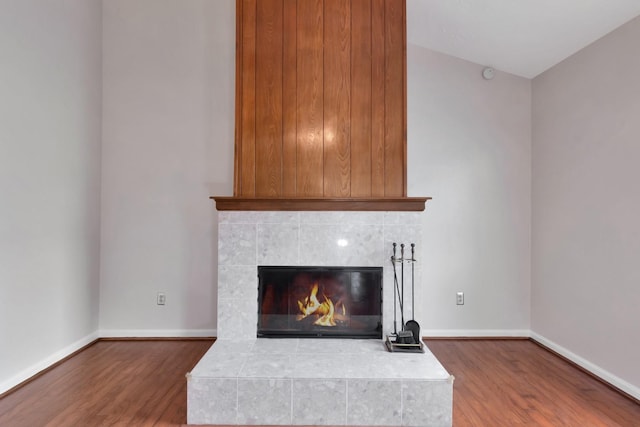 11014 Kirkridge Dr, Houston, TX 77089 - detailed view of wood finished floors, baseboards, and a tile fireplace