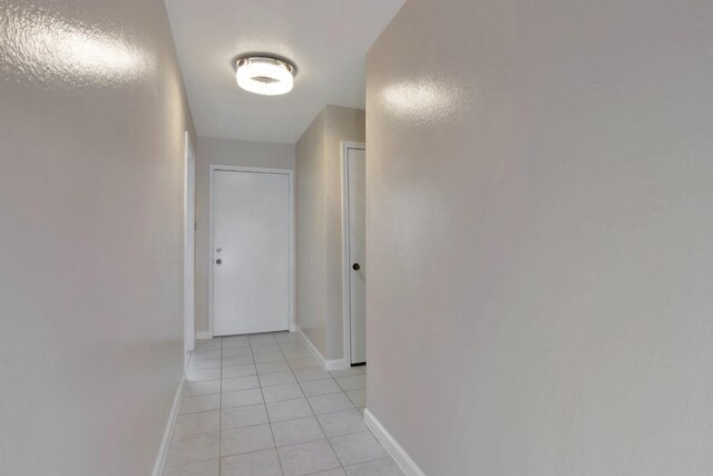 11014 Kirkridge Dr, Houston, TX 77089 - hallway with light tile patterned flooring and baseboards