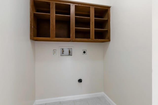 11014 Kirkridge Dr, Houston, TX 77089 - laundry room with electric dryer hookup, washer hookup, baseboards, and light tile patterned flooring