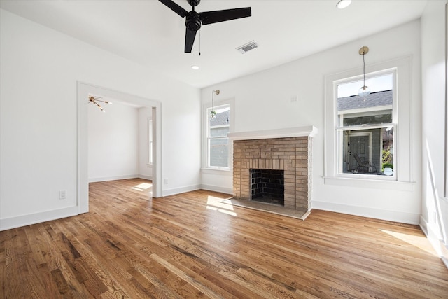 1546 Lawson St, Houston, TX 77023 - unfurnished living room featuring a fireplace, a ceiling fan, wood finished floors, baseboards, and recessed lighting