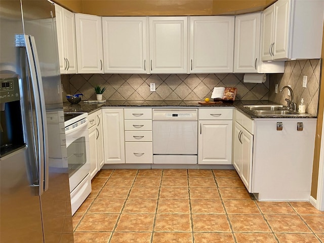 2478 Bering Dr Unit 2478, Houston, TX 77057 - kitchen featuring white appliances, a sink, white cabinetry, and dark countertops