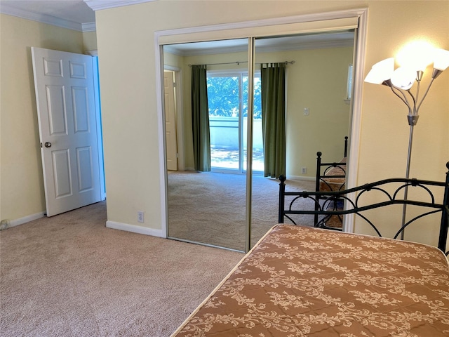 2478 Bering Dr Unit 2478, Houston, TX 77057 - carpeted bedroom with crown molding, a closet, and baseboards