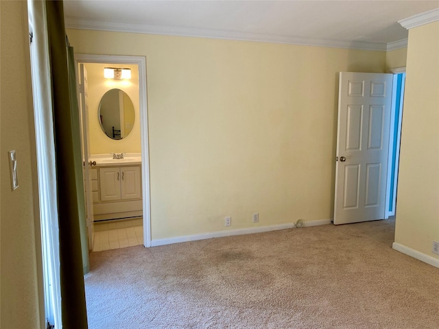 2478 Bering Dr Unit 2478, Houston, TX 77057 - unfurnished bedroom with light carpet, ornamental molding, baseboards, a sink, and connected bathroom