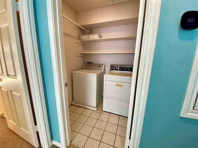 2478 Bering Dr Unit 2478, Houston, TX 77057 - laundry area featuring separate washer and dryer and light tile patterned floors