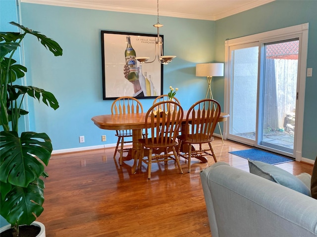 2478 Bering Dr Unit 2478, Houston, TX 77057 - dining room featuring wood finished floors, ornamental molding, and baseboards