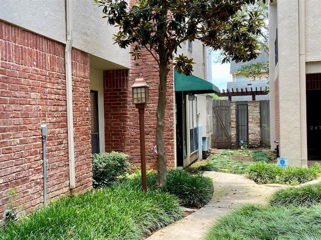 2478 Bering Dr Unit 2478, Houston, TX 77057 - view of side of property with stucco siding and brick siding