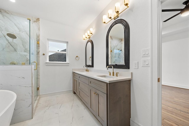 1013 E 28th St, Houston, TX 77009 - full bathroom featuring marble finish flooring, a soaking tub, double vanity, a marble finish shower, and baseboards