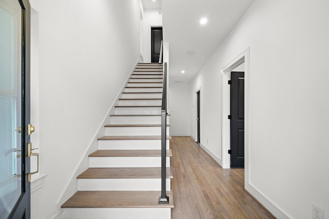 1013 E 28th St, Houston, TX 77009 - stairs with recessed lighting, wood finished floors, and baseboards